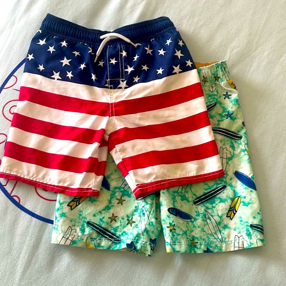 Boys 5T board-shorts. Great condition. American flag and surf theme. W/liners